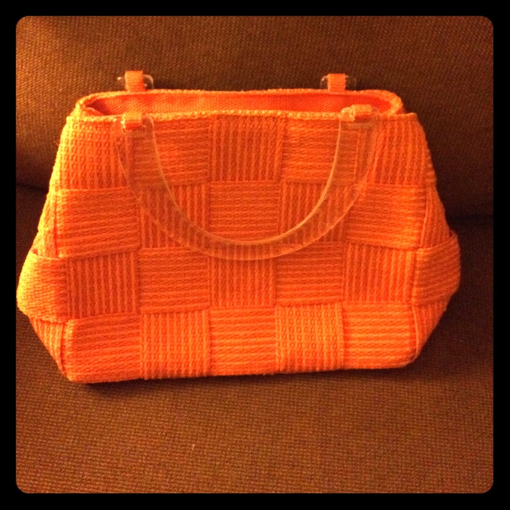 Orange bag with clear handles, design of Italy